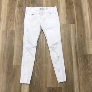 Skinny distressed white jeans